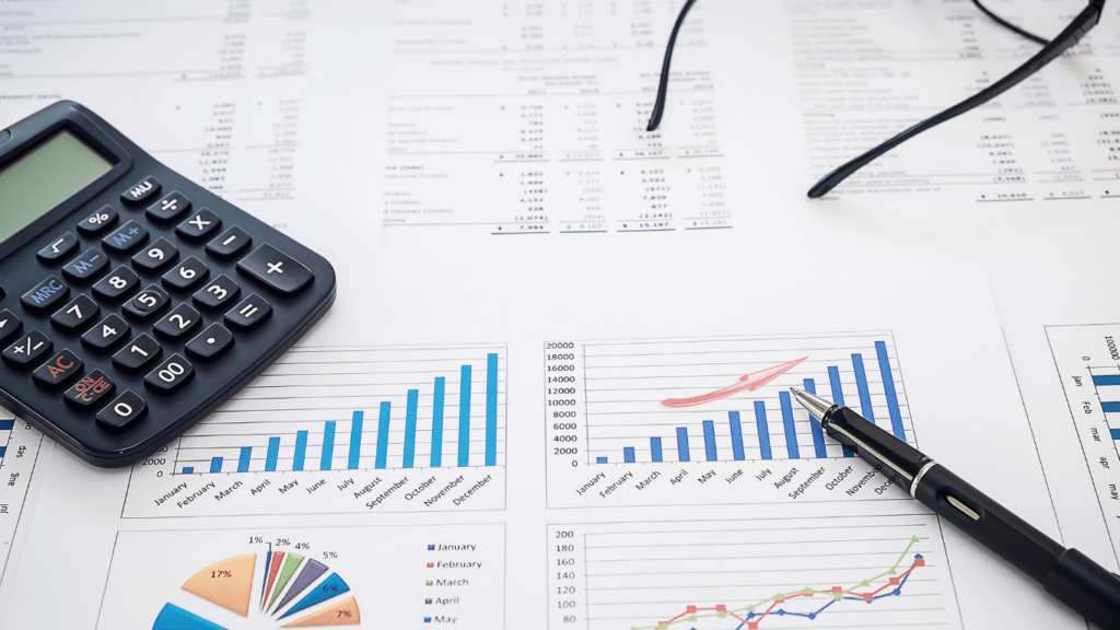 Calculator and pen on a financial document