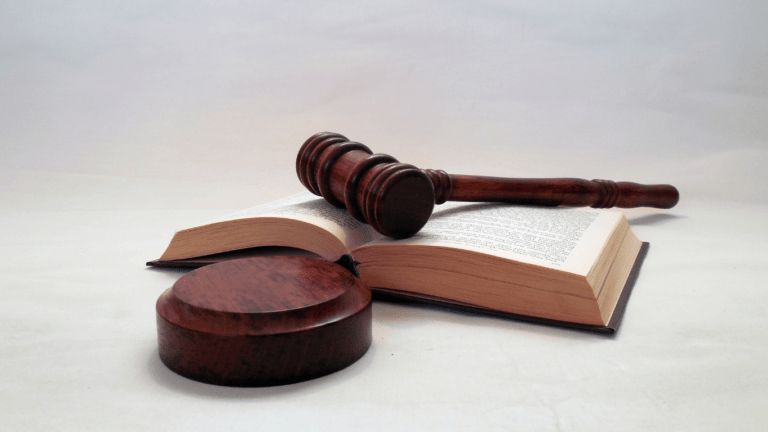 wooden gavel and book