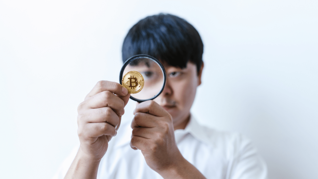 a person holding a crypto