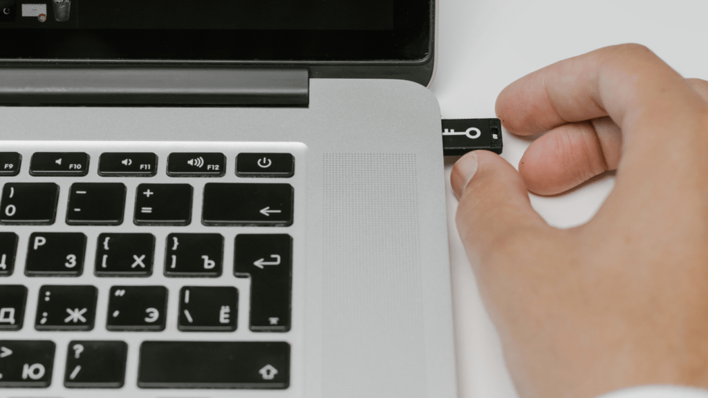 a person is using an electronic device on a desk