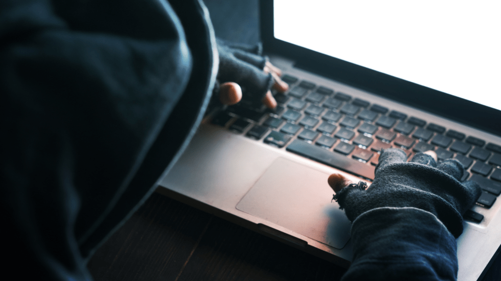 a person typing on a laptop computer