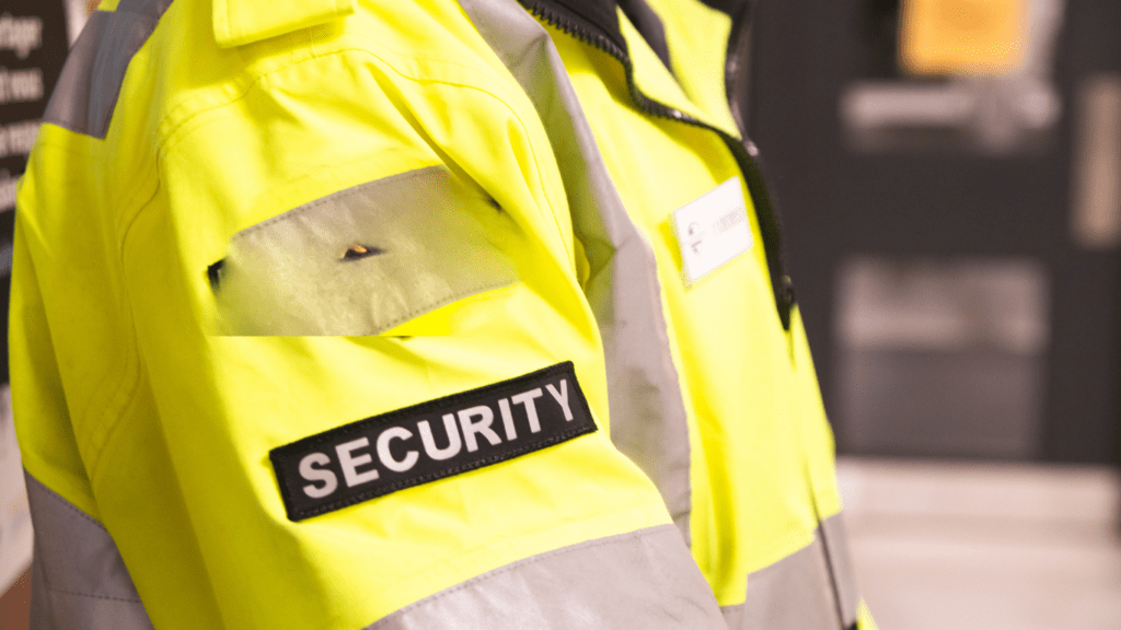 a person wearing a security guard uniform